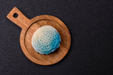 Çin ay çöreği, pirinç hamuru ve meyve dolgulu Asya tatlı tatlısıdır. Tasarımınız için arka plan olarak Asya ay pastası