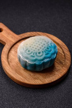 Çin ay çöreği, pirinç hamuru ve meyve dolgulu Asya tatlı tatlısıdır. Tasarımınız için arka plan olarak Asya ay pastası