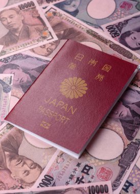 Japanese passport or id document with tickets for flight, travel, border crossing. Japan passport and tickets as a background for your design