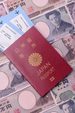 Japanese passport or id document with tickets for flight, travel, border crossing. Japan passport and tickets as a background for your design