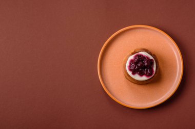 Cinnamon roll, a sweet bun with citrus, cherries, and chocolate, a Danish dessert with cream. Cinnamon roll as a food background for your design