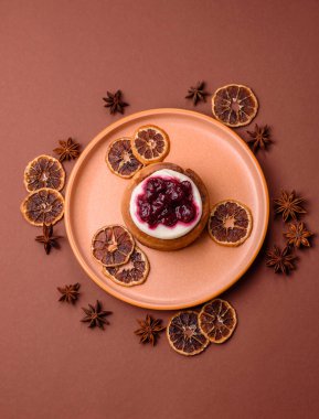 Cinnamon roll, a sweet bun with citrus, cherries, and chocolate, a Danish dessert with cream. Cinnamon roll as a food background for your design