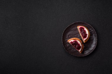 Cinnamon roll, a sweet bun with citrus, cherries, and chocolate, a Danish dessert with cream. Cinnamon roll as a food background for your design