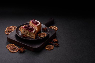 Cinnamon roll, a sweet bun with citrus, cherries, and chocolate, a Danish dessert with cream. Cinnamon roll as a food background for your design