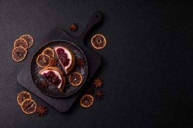 Cinnamon roll, a sweet bun with citrus, cherries, and chocolate, a Danish dessert with cream. Cinnamon roll as a food background for your design