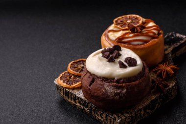 Cinnamon roll, a sweet bun with citrus, cherries, and chocolate, a Danish dessert with cream. Cinnamon roll as a food background for your design