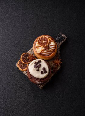 Cinnamon roll, a sweet bun with citrus, cherries, and chocolate, a Danish dessert with cream. Cinnamon roll as a food background for your design