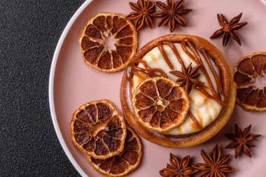 Cinnamon roll, a sweet bun with citrus, cherries, and chocolate, a Danish dessert with cream. Cinnamon roll as a food background for your design