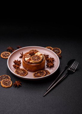 Cinnamon roll, a sweet bun with citrus, cherries, and chocolate, a Danish dessert with cream. Cinnamon roll as a food background for your design