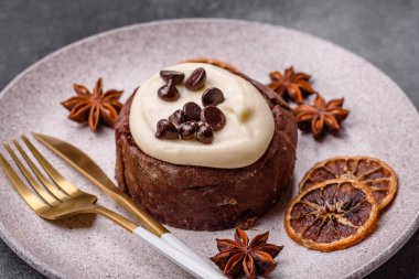 Cinnamon roll, a sweet bun with citrus, cherries, and chocolate, a Danish dessert with cream. Cinnamon roll as a food background for your design