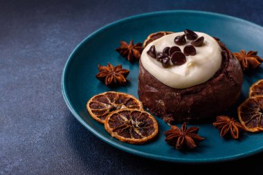 Cinnamon roll, a sweet bun with citrus, cherries, and chocolate, a Danish dessert with cream. Cinnamon roll as a food background for your design