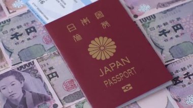 Japanese passport or id document with tickets for flight, travel, border crossing. Japan passport and tickets as a background for your design