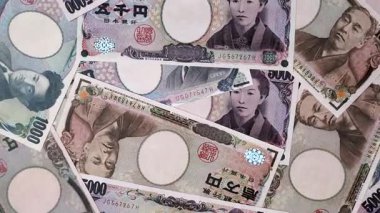 Japonya, Japon yeni kağıt banknotlar, iş için para, finansal işlemler ve anlaşmalar. Tasarımınız için finansal bir arkaplan olarak Japonca yen.