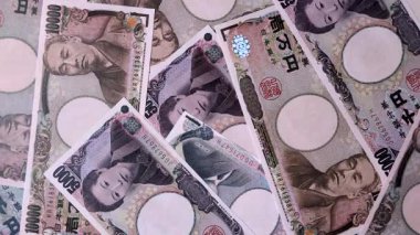 Japonya, Japon yeni kağıt banknotlar, iş için para, finansal işlemler ve anlaşmalar. Tasarımınız için finansal bir arkaplan olarak Japonca yen.