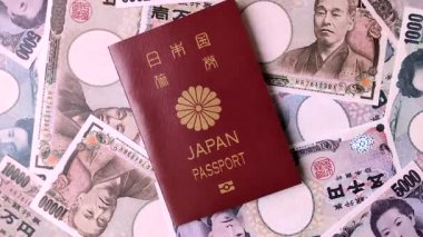 Japanese passport or id document with tickets for flight, travel, border crossing. Japan passport and tickets as a background for your design