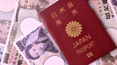Japanese passport or id document with tickets for flight, travel, border crossing. Japan passport and tickets as a background for your design