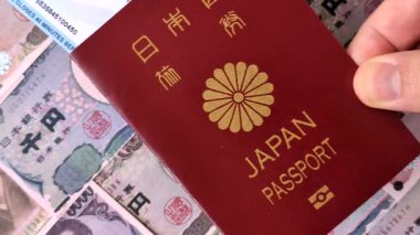 Japanese passport or id document with tickets for flight, travel, border crossing. Japan passport and tickets as a background for your design
