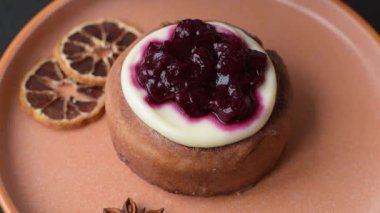 Cinnamon roll, a sweet bun with citrus, cherries, and chocolate, a Danish dessert with cream