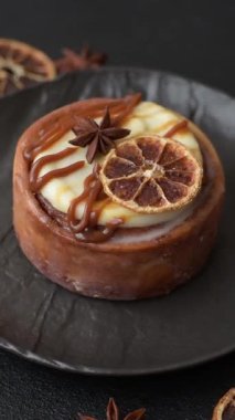 Cinnamon roll, a sweet bun with citrus, cherries, and chocolate, a Danish dessert with cream