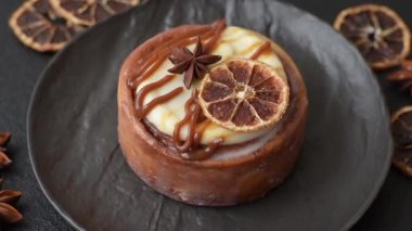 Cinnamon roll, a sweet bun with citrus, cherries, and chocolate, a Danish dessert with cream