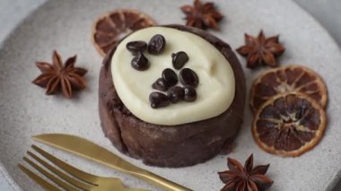 Cinnamon roll, a sweet bun with citrus, cherries, and chocolate, a Danish dessert with cream