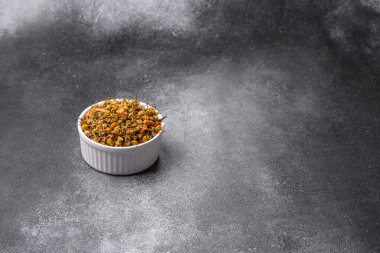 Dried chamomile flowers, herbal tea in a bowl for a hot morning drink. Dried chamomile as a background for your design.