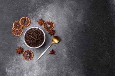 Golden black tea, dried leaves of a Chinese or Indian breakfast drink. Black tea dried leaves as a food backdrop for your design