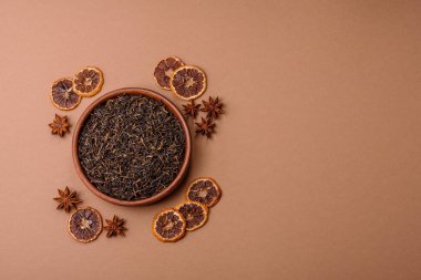 Golden black tea, dried leaves of a Chinese or Indian breakfast drink. Black tea dried leaves as a food backdrop for your design