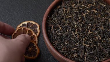 Golden black tea, dried leaves of a Chinese or Indian breakfast drink. Black tea dried leaves as a food backdrop for your design