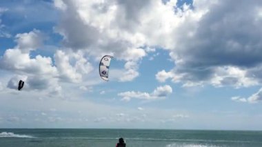 Spain, Lanzarote, Famara beach - The people are engaged in kitesurfing on the waves