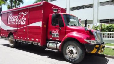 Colombia , Santa Marta 2022 - Old American red Coca-Cola truck camion brings Coca-Cala cans home - a delivery truck