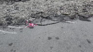 cracked asphalt with debris