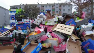Europe, Italy , Milan 2022 - Giambellino poor neighborhood in suburbs, fruit vegetable market in the street and poor people look for food among the waste of the stalls - economic crisis and poverty
