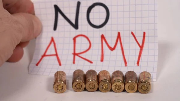 No Army and no war logo sign with 9 mm revolver gun bullets - peace message - firearms license more and more widespread in the USA, America and in the world for private security