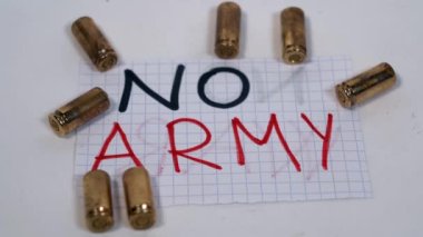 No Army and no war logo sign with 9 mm revolver gun bullets - peace message - firearms license more and more widespread in the USA, America and in the world for private security
