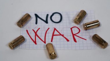 No Army and no war logo sign with 9 mm revolver gun bullets - peace message - firearms license more and more widespread in the USA, America and in the world for private security