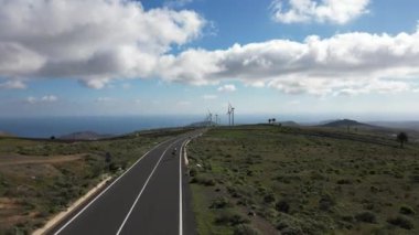 Drone view of mills, wind turbines for the production of clean electricity - green economy and environmental sustainability - save the Planet concept against climate change, global warming - Lanzarote