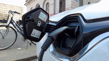 Europe, Italy , Milan 2023 -   The EU has banned the sale of cars with polluting petrol and diesel engines since 2035 - sustainable mobility and green economy - Traffic car and smog Pm10 in downtown 