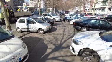 Europe, Italy , Milan 2023 - The EU has banned the sale of cars with polluting petrol and diesel engines since 2035 - sustainable mobility and green economy - Traffic car and smog Pm10 in downtown