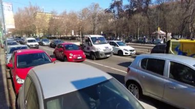 Europe, Italy , Milan 2023 - The EU has banned the sale of cars with polluting petrol and diesel engines since 2035 - sustainable mobility and green economy - Traffic car and smog Pm10 in downtown