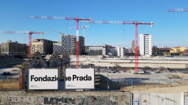 EUROPE, ITALY, MILAN 2023 - Drone aerial view of Scalo Porta Romana, building construction of Olympic Village for Milan-Cortina 2026 Winter Olympics games in downtown of the city near Prada Tower  