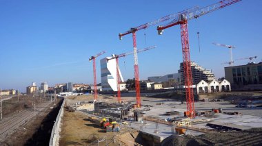 EUROPE, ITALY, MILAN 2023 - Drone aerial view of Scalo Porta Romana, building construction of Olympic Village for Milan-Cortina 2026 Winter Olympics games in downtown of the city near Prada Tower  