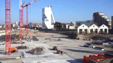 EUROPE, ITALY, MILAN 2023 - Drone aerial view of Scalo Porta Romana, building construction of Olympic Village for Milan-Cortina 2026 Winter Olympics games in downtown of the city near Prada Tower