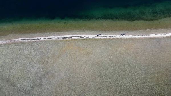 stock image Italy, Lake Garda ,San Biagio Island , Rabbit Island - the shallow waters of the lake allow you to walk and reach the island on foot - water emergency in Lombardy , drought lowering of the water level