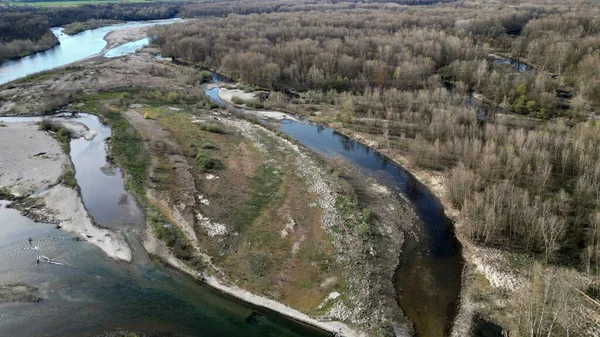 stock image water emergency and drought  due to lack of rain due to global warming and the decrease of glaciers - Drone aerial view of dry river with scarcity of water in Lombardy Pavia - Ticino di Besate 