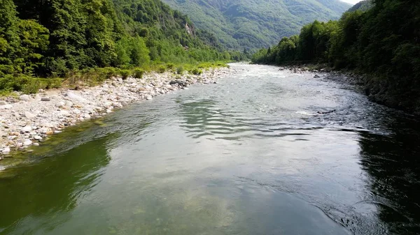 stock image Go rafting on the river with dinghies immersed in the rapids of the stream and the nature of the canyon in Val Sesia Alagna Piedmont Alps mountains - drone view of summer water sport activities