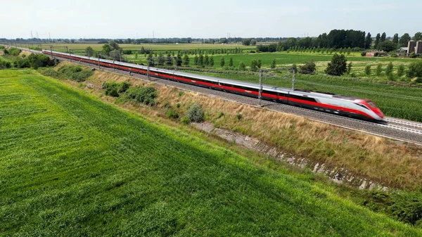 stock image Europe, Italy , Milan - Frecciarossa Hight speed 300km h train railway from Milano to Rome view from the drone - the faster way to travel in Italy for tourist and passengers - tourist destination