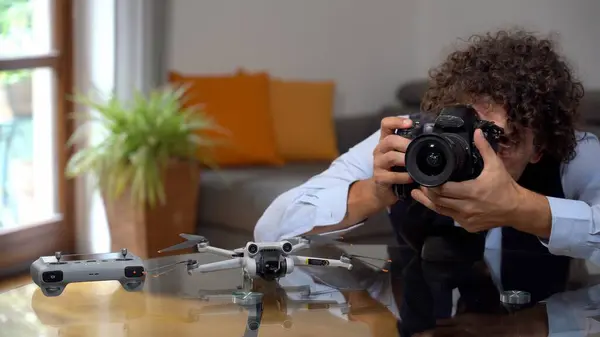 Italy , Milan - Real estate photographer use professional drone and camera to take pictures and video of the house - interior home shooting - home staging to sell the property apartment