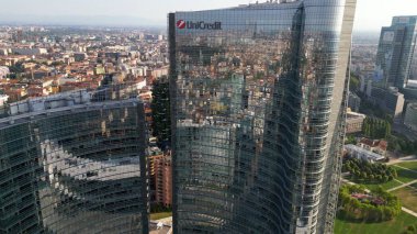 Milan, Italy: 08.28.2024 - drone view of Garibaldi Porta Nuova District in downtown of the city Gae Aulenti BAM new skyline with Unipol, UniCredit skyscrapers clipart