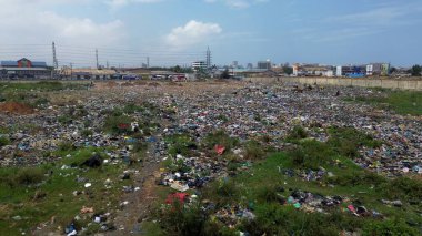 Ghana, Accra, 10,18,24  AGBOGBLOSHIE  people live in slum largest landfill illegal dump in Africa for electronic and plastic waste.  Odaw River High environmental toxic pollution area, climate change  clipart